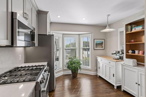 Bosch gas stove, microwave, and dishwasher, LG Fridge - great natural lighting from the bay windows