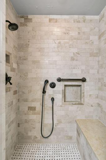 Beautiful tile work with niche and bench seating