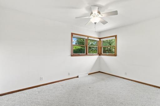 Primary bedroom - Hardwood flooring under carpet
