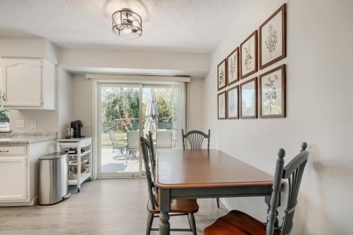 Eat-in kitchen with Informal Dining area. Patio doors lead to a maintenance free Deck and a BIG backyard that is fenced. A kids playset, basketball hoop and backyard shed too!
