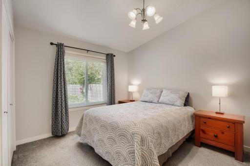 The Primary Bedroom has a vaulted ceiling and overlooks the backyard.