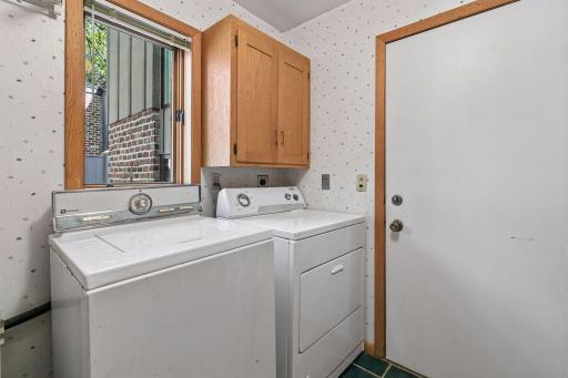 Main floor laundry area off kitchen.