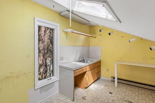 Built above the garage is an unfinished "hobby" room with lots of additional storage.