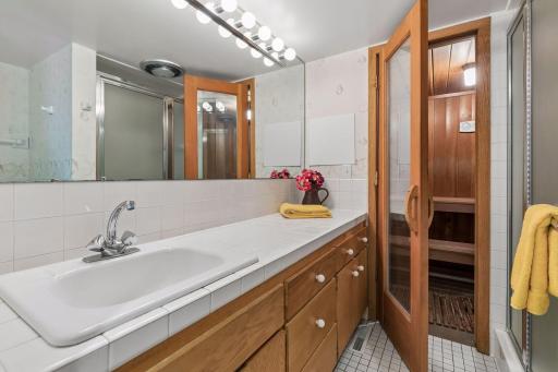 Lower level bath has a shower and a beautiful sauna!