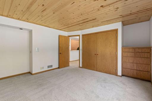 This bedroom also has a complete wall of closets and built-in dresser.