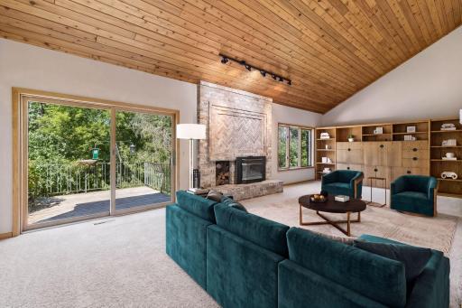 Virtually staged, this spacious lilving room features built-in bookcases and storage on east end of room.
