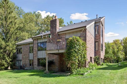 North side view of twin home shows the additional attached twin home on the far left side of photo.