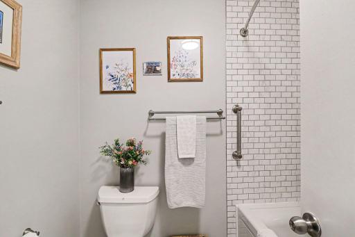 Owner's bath features updated subway tile in the shower..