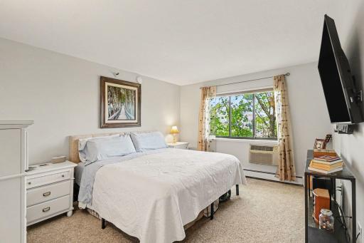 Owner's bedroom fits a king bed plus furniture easily with room to move.