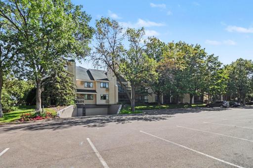 Garage entrance in from the parking lot off Edinborough Way. Plus plenty of guest parking.