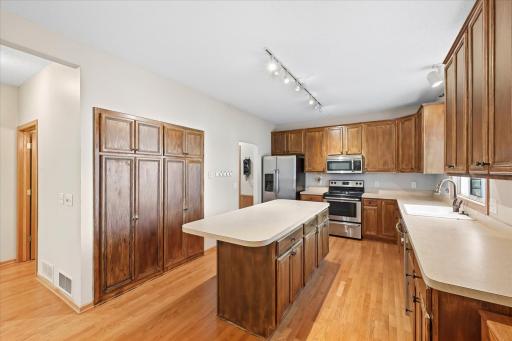 Well-appointed kitchen offering abundant workspace and seamless flow to dining and living areas. Mud room and Laundry room are accessed from the back of the fitcehn.