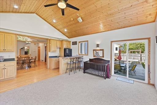 Entertain with ease from the porch wet bar overlooking the fenced backyard.