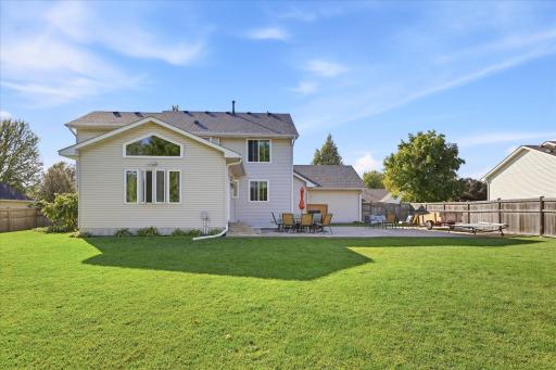 Expansive patio provides the perfect setting for outdoor dining and relaxation with a fully fenced backyard offering space to play, entertain, and unwind.
