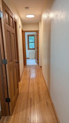 Main level hallways with 6 panel solid core doors.