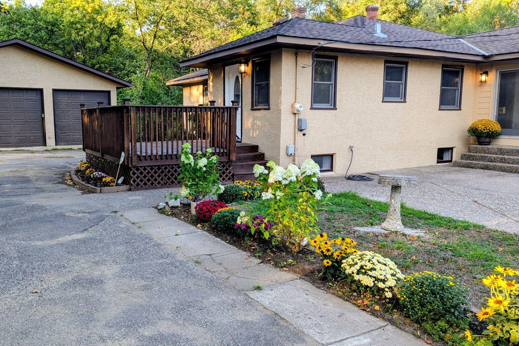 Beautiful remodeled home on 3/4 acre with oversized detached garage. Lower level living space with kitchen. Features real Hardwood floors, new appliances.