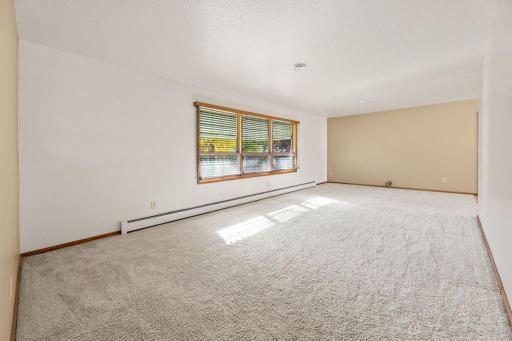 Living Room w/ large windows facing the backyard