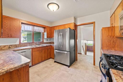 Kitchen view to entry hallway & lower level