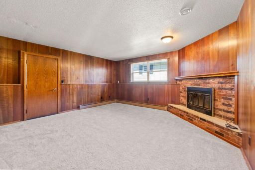 Gorgeous wood walls w/ fireplace & mantle