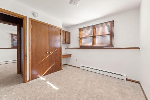 Lower level Bedroom 5 w/ built-in desk & storage