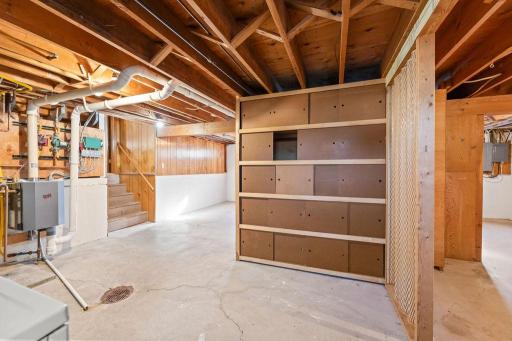 Basement view to lower level. Built-in storage wall