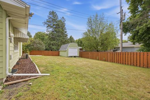 Huge, fully fenced backyard w/ large storage shed