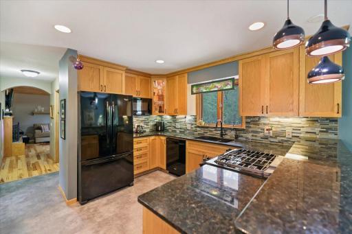Granite counter tops and gas slide in range.