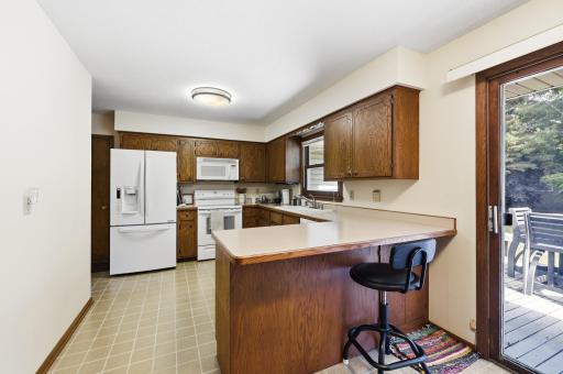 Spacious kitchen has an abundance of cabinet and counter top space along with a convenient breakfast bar!