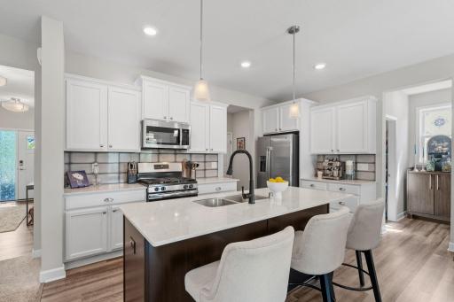 Kitchen island is great for extra prep space and guests