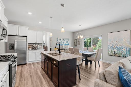 Kitchen opens into the informal dining space and out to the amazing patio!