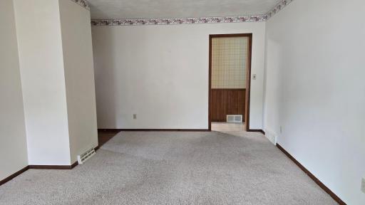living room and entrance to kitchen and hallway.jpg