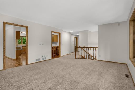 Living room with kitchen on left