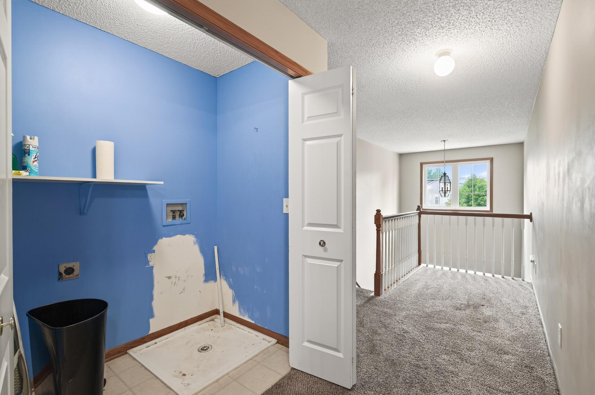 Upstairs laundry and loft area
