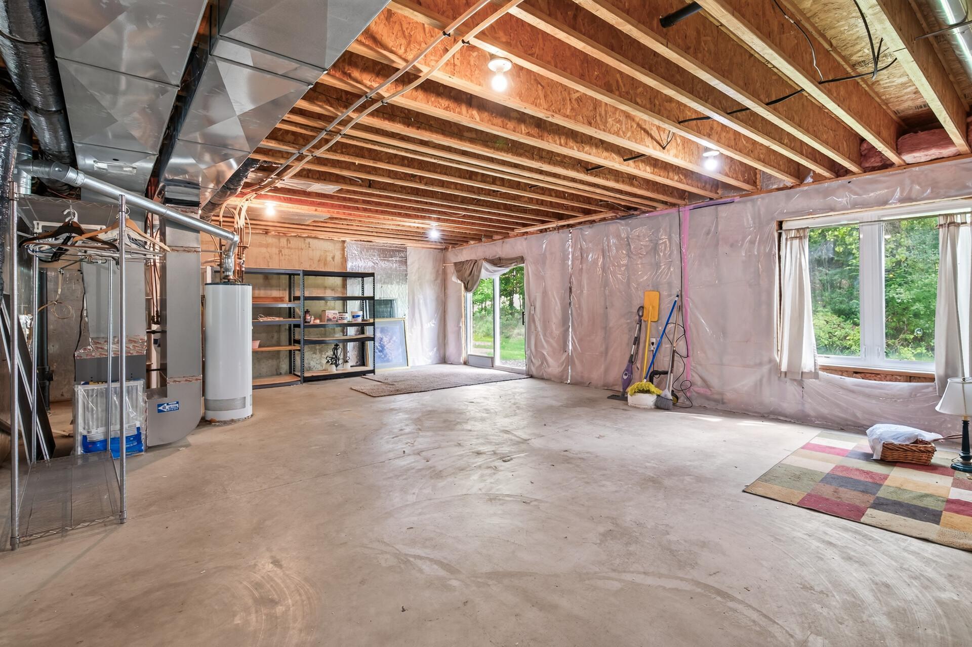 Large unfinished basement with potential for additional bed, bath and family room