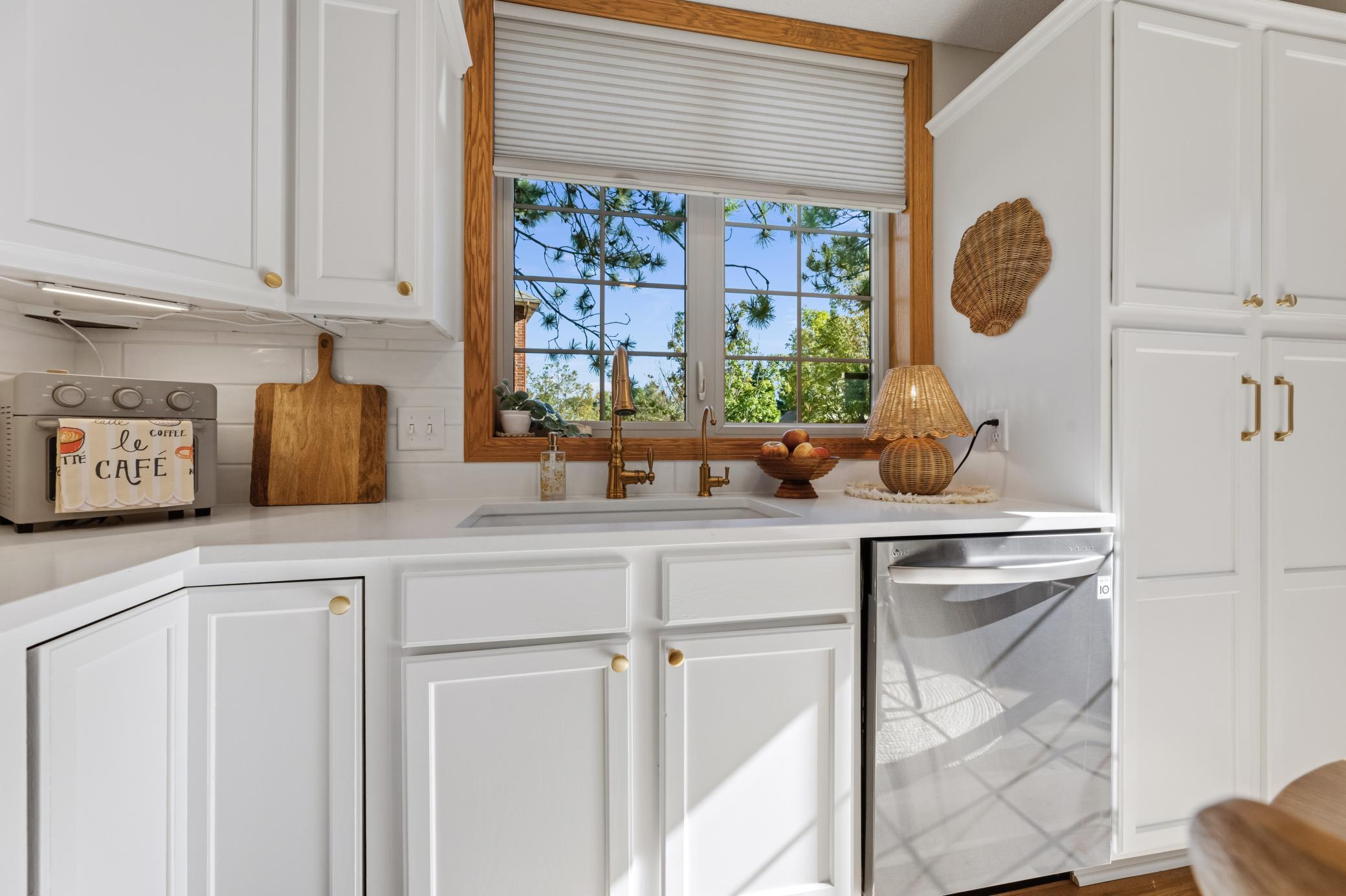 Enjoy plenty of cabinetry, counter space and a window overlooking the outdoor surroundings.