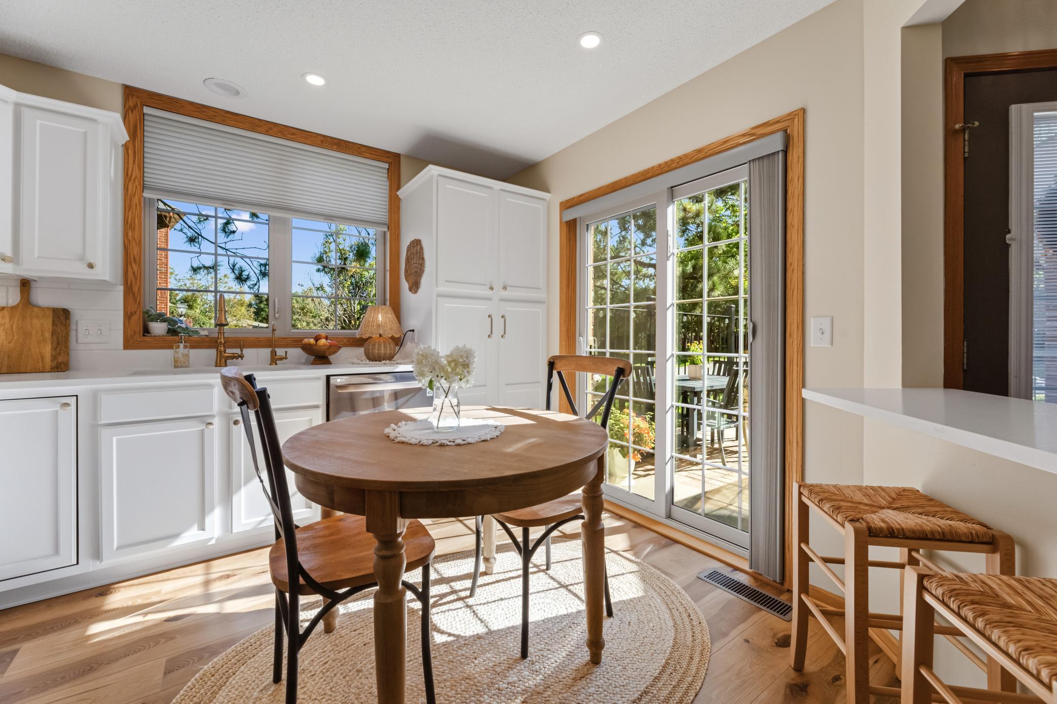 Sun-filled dining nook with direct access to the patio—perfect for indoor-outdoor living.