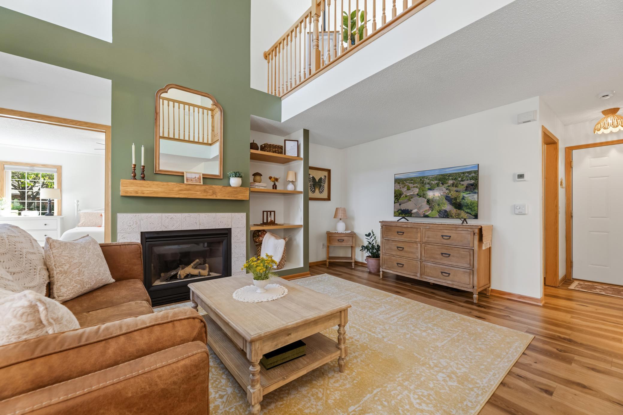 Open and airy main-level living with warm wood floors and beautiful natural light.