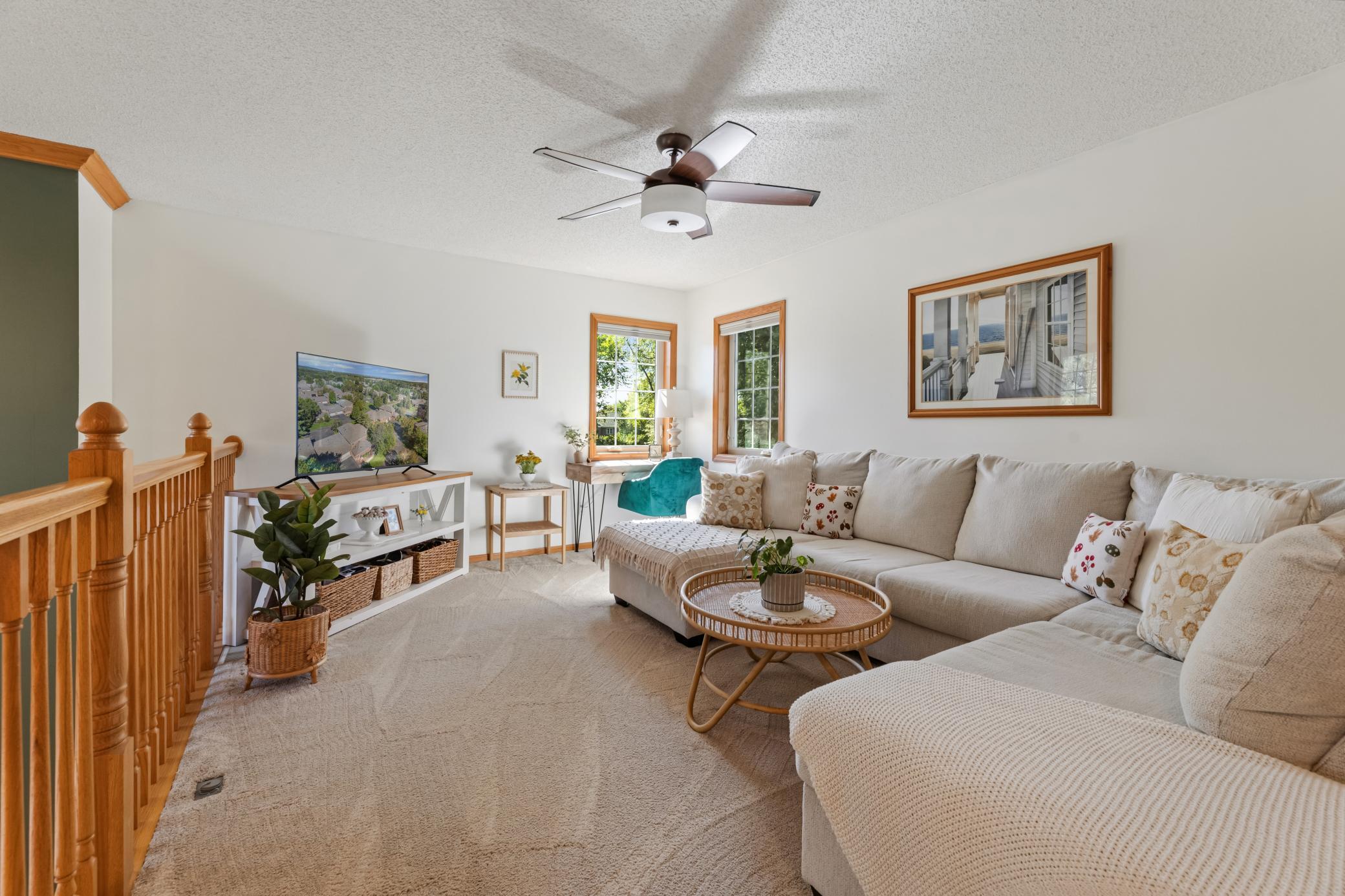 The upper-level features a generously sized loft offering a comfortable second living space or relaxing retreat.
