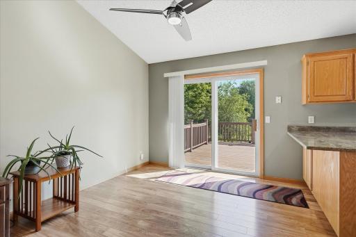 Dining area features LVP flooring and direct access to the 18x16 maintenance-free deck—perfect for extending everyday living outdoors.