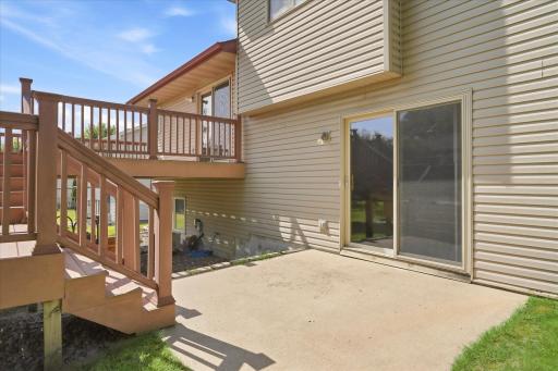 Multi-level deck and patio offer plenty of space for outdoor dining, grilling, relaxing, and entertaining while overlooking the backyard.