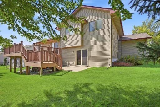 The spacious backyard, multi-level deck, and lower-level walkout to the patio.