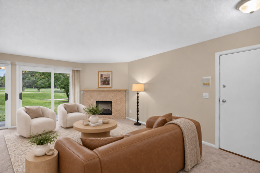 Spacious main-level living area with abundant natural light. Digitally Staged