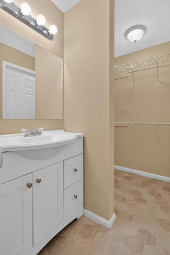 Primary suite features a private quarter bath and adjoining walk-in closet.