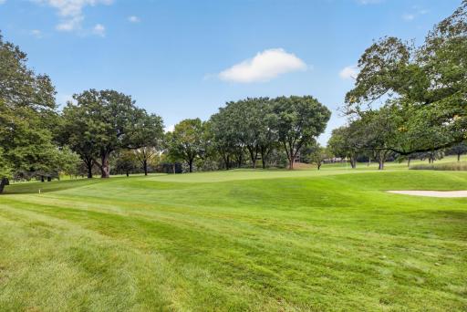 Enjoy peaceful golf course views directly behind the home.