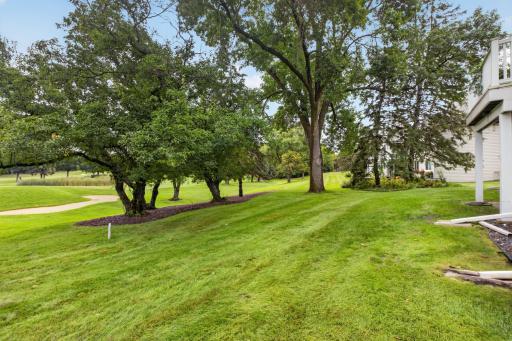 : Expansive backyard views overlooking the neighboring golf course.