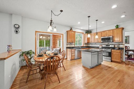 Recently installed hardwood floors, informal dining, sliding glass door to the 4 season porch, granite countertops, recessed lighting , kitchen opens up to the family room.