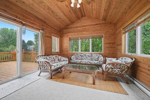 4 season porch off the kitchen, oversized door to the deck. Lots of natural light, mature trees provide lots of privacy.