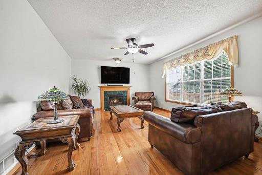 Full view of the family room, triple windows , gas fireplace.