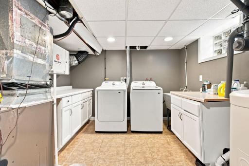 Laundry room features newer washer and dryer and whole house dehumidifier.