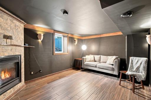 4th bedroom on lower level with gas fireplace and fiberoptic lighting in ceiling displays the constellations.