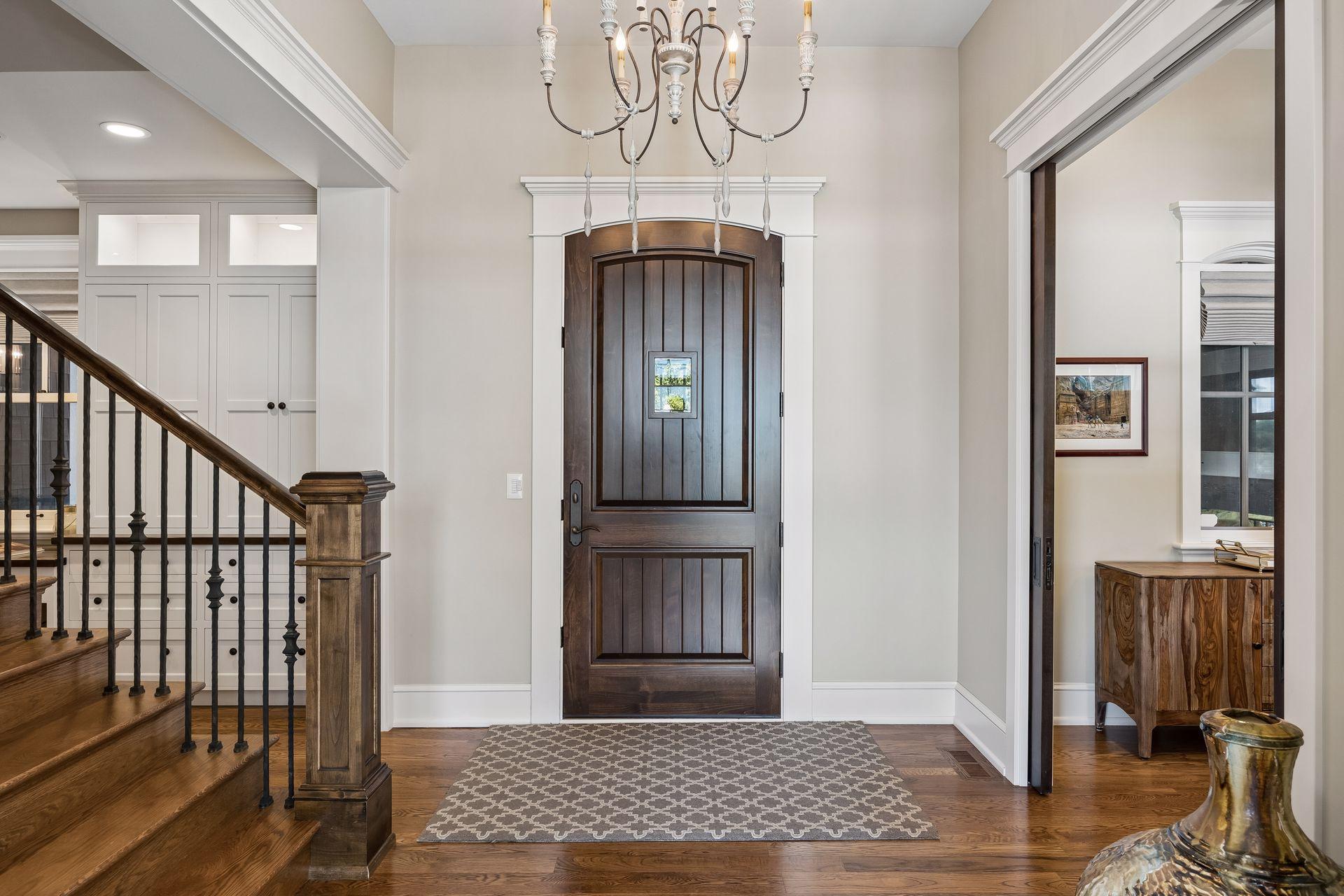 Grand foyer with custom millwork and staircase